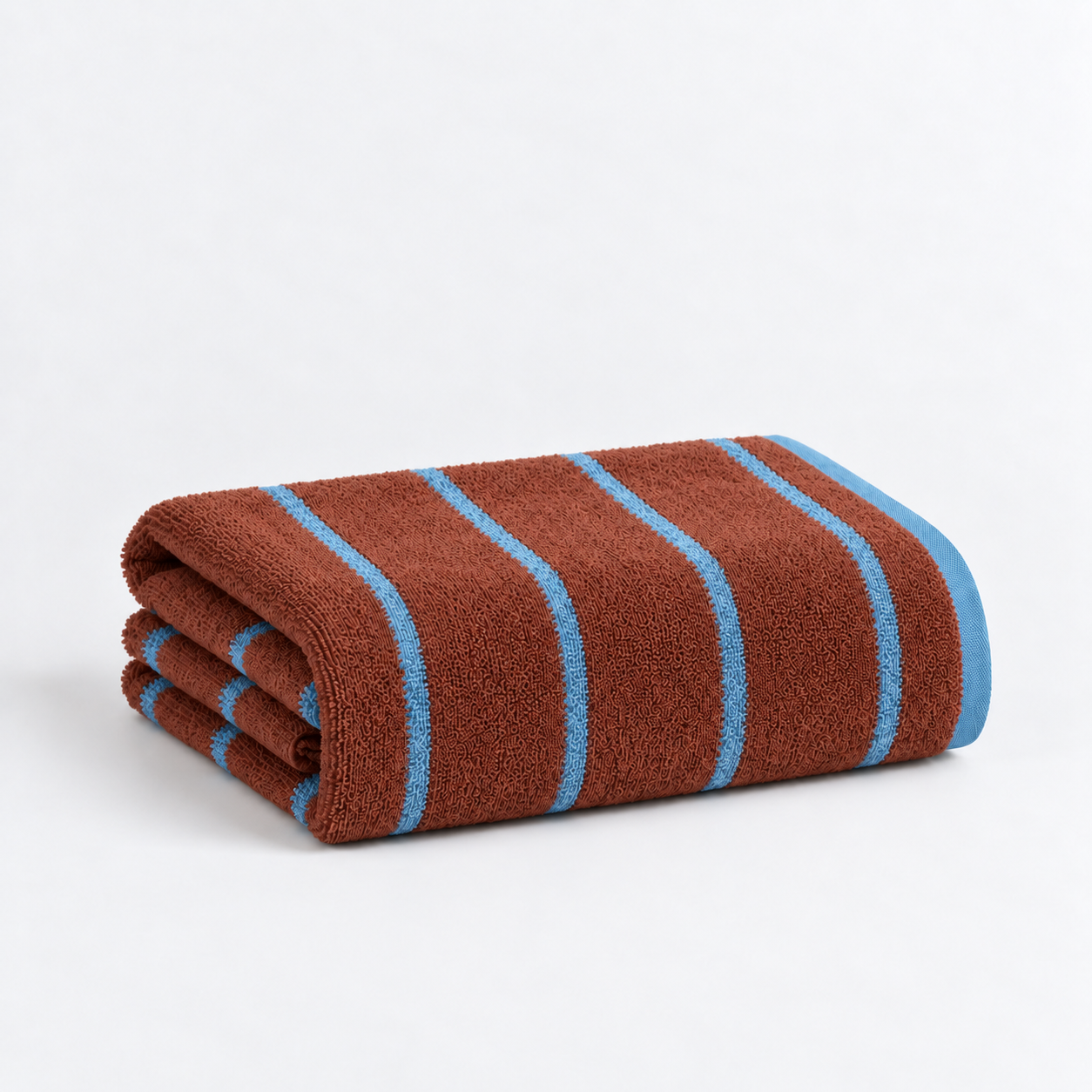 Folded bath towel from the Stay Soft™ Neutral Towel Collection in Brown, with contrast blue stripes