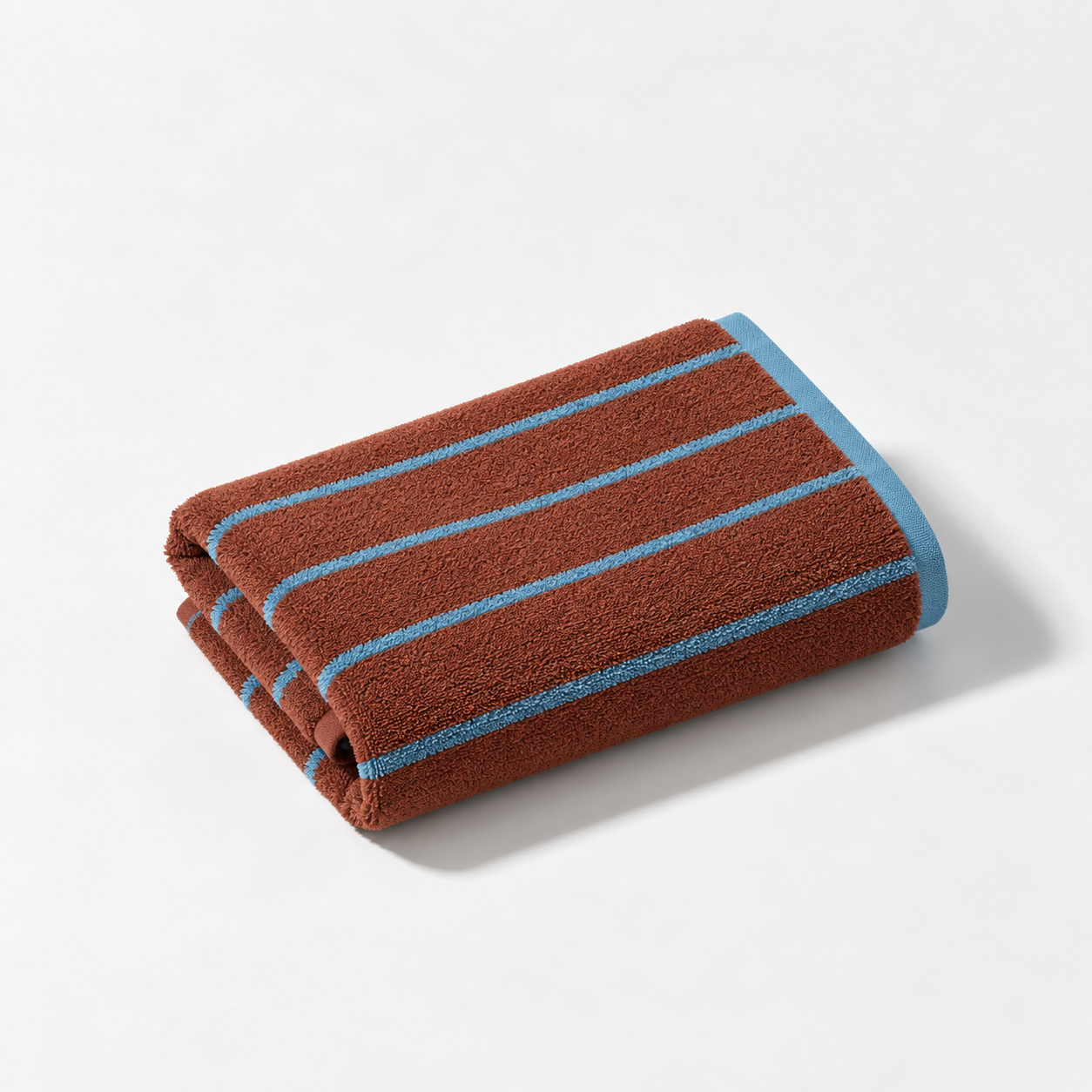 Stay Soft™ Neutral Towel Collection hand towel in Brown, folded with retro blue stripes and contrast edge