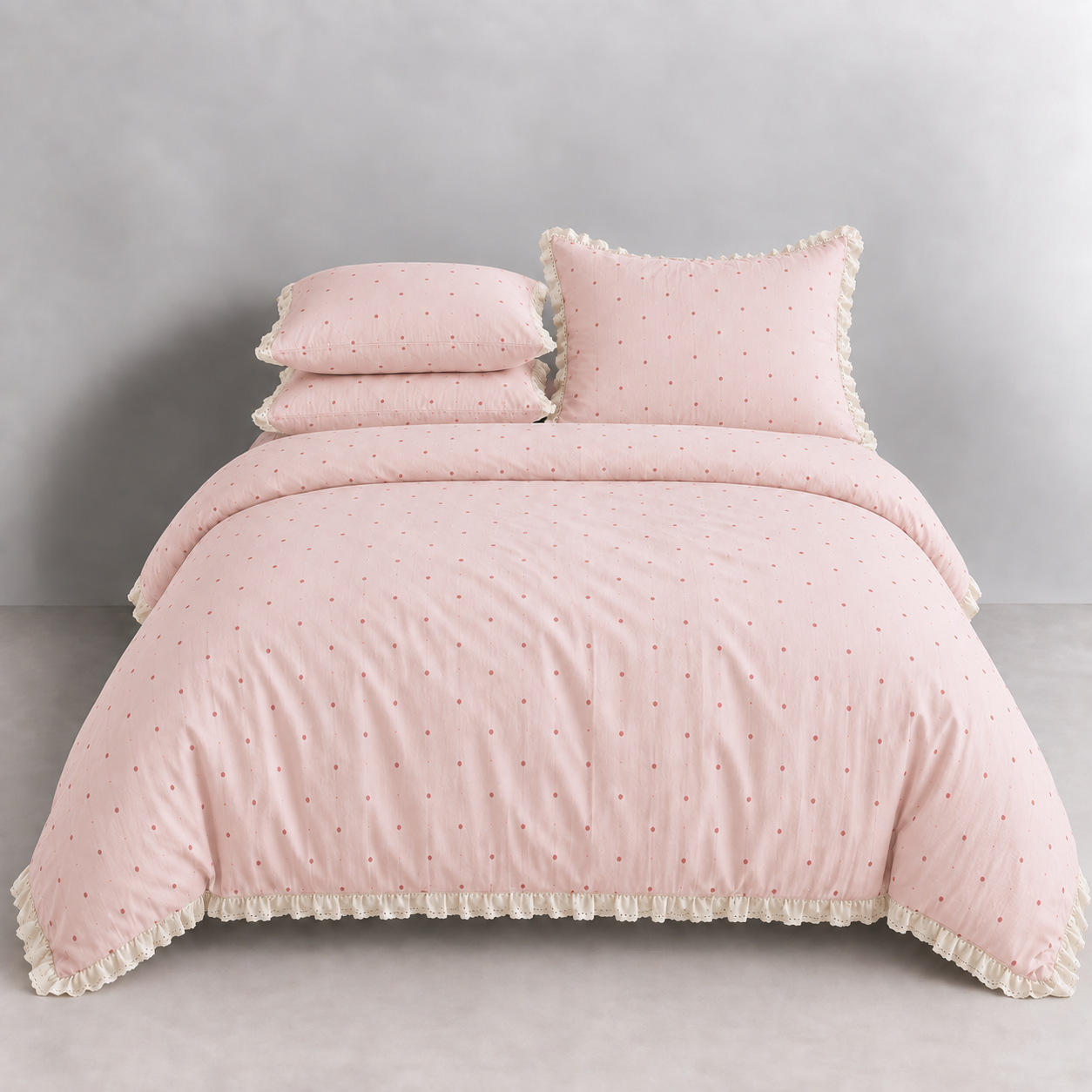 Sundae Spot Bedding Set in Blush Polka, made bed with scattered dots and gathered frill trim