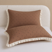 Two pillowcases from the Sundae Spot Bedding Set in Coffee Polka, brown polka dot with a frilled cream edge