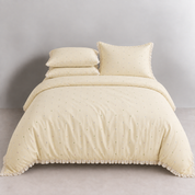 Sundae Spot Bedding Set in Custard Polka, made bed with scattered dots and a soft gathered frill