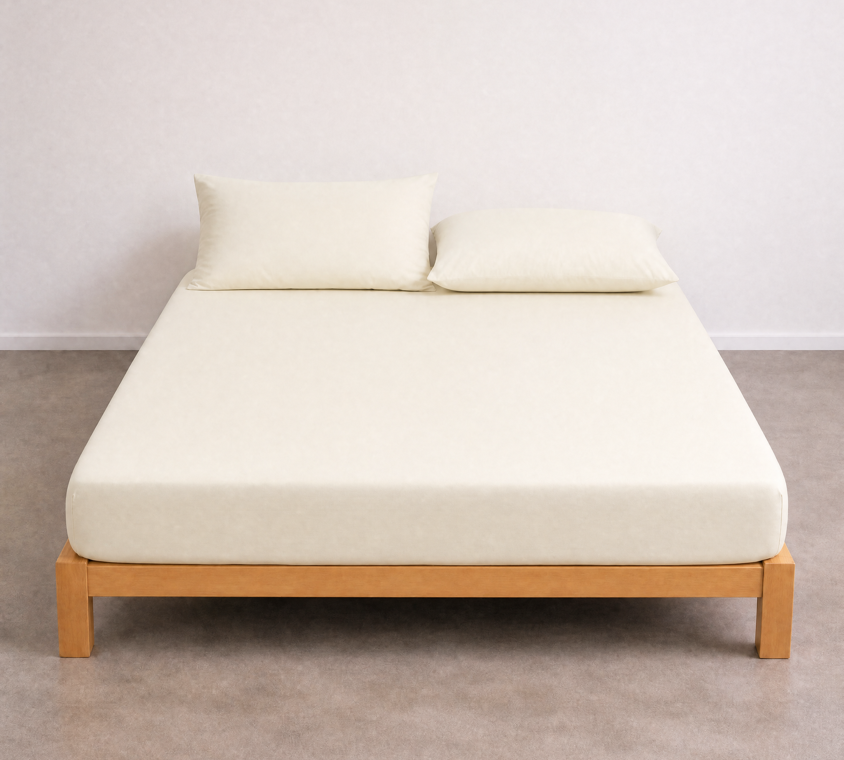 Tate Fitted Sheet in Beige, fitted smoothly over a mattress on a timber bed frame