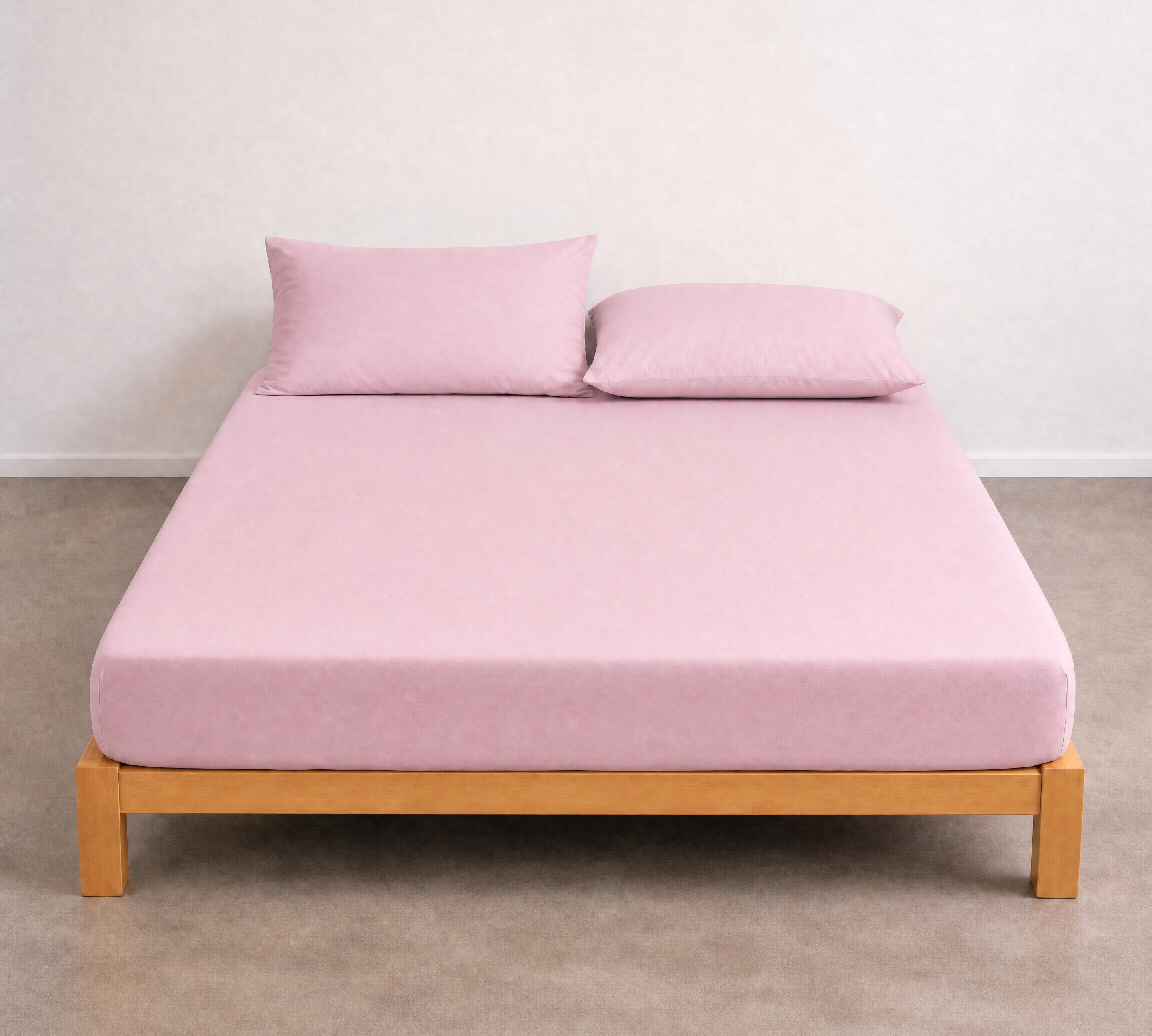 Tate Fitted Sheet in Pink on a timber bed frame, smooth twill weave with matching pillowcases