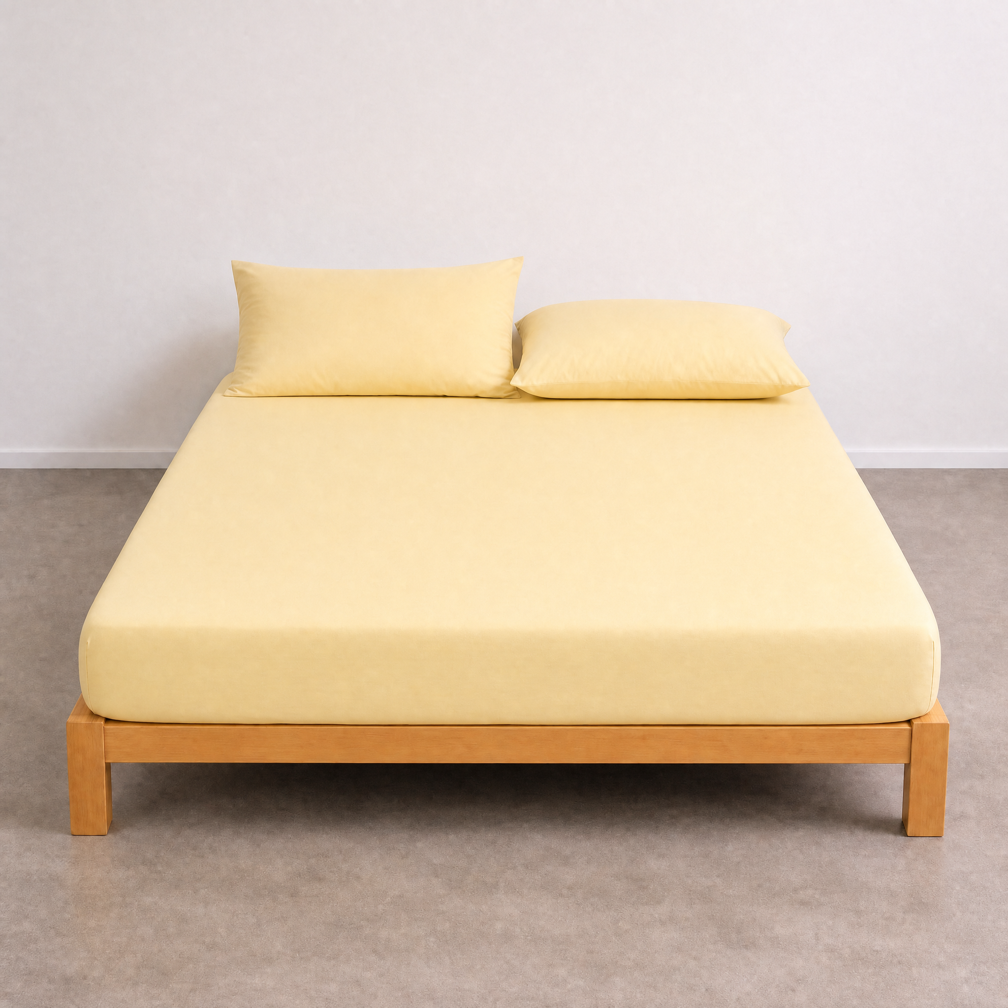 Tate Fitted Sheet in Yellow, fitted snugly over a mattress on a timber bed frame