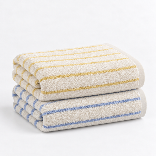 Tilly Towel Set in Lemon Cream & Ice, folded stack with mustard and pale blue stripes on cream cotton