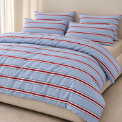Vida Bedding Set in Blue & Red, striped quilt cover and pillowcases styled on a made bed