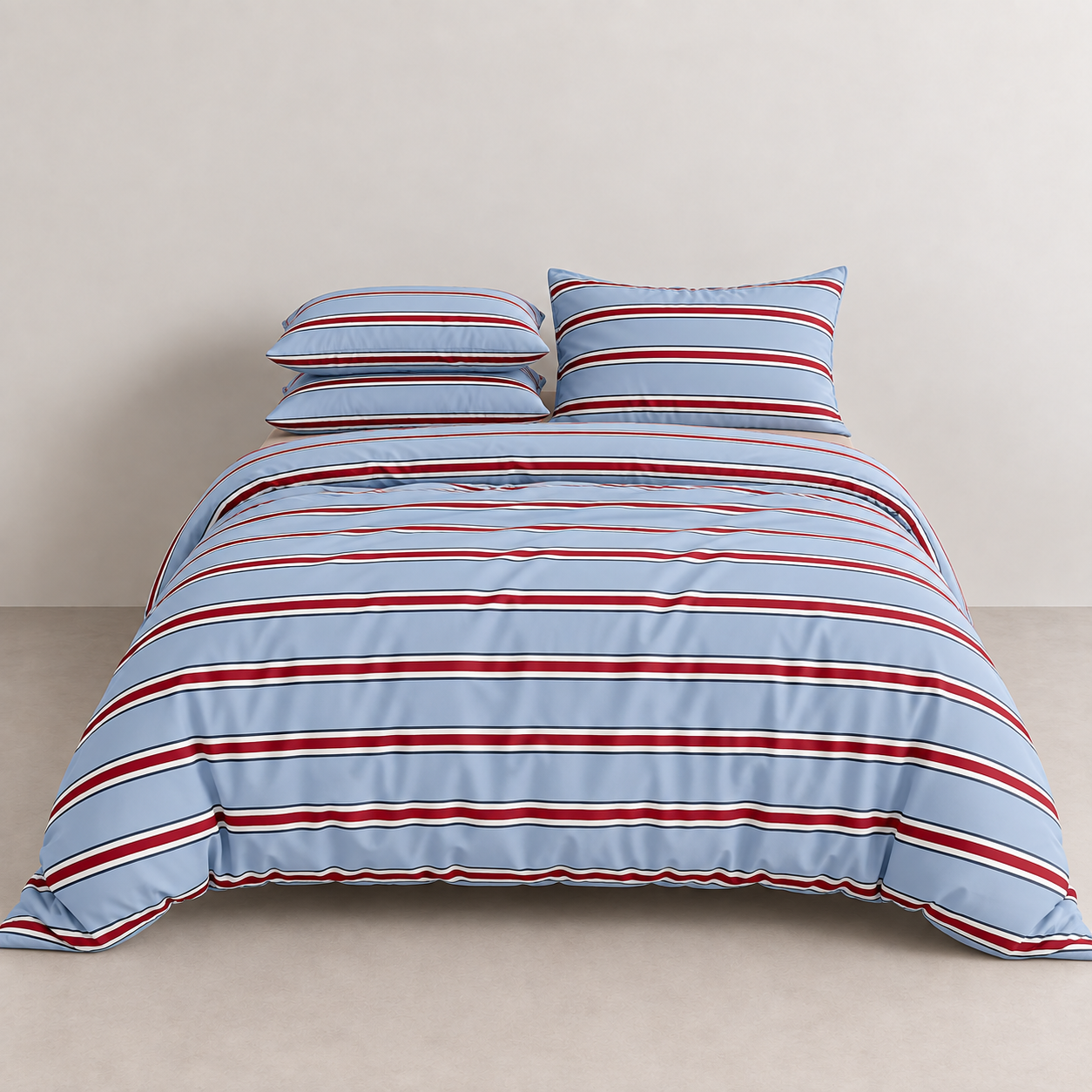 Vida Bedding Set in Blue & Red, striped quilt cover and pillowcases on a made bed against a plain wall