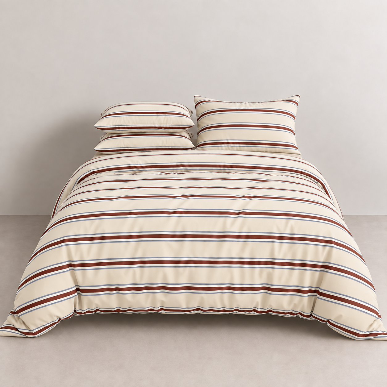 Vida Bedding Set in Rust & Cream, striped quilt cover with matching pillowcases on a made bed